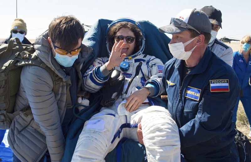 In this handout photo released by Gagarin Cosmonaut Training Centre (GCTC), Roscosmos space agency, U.S. astronauts Andrew Morgan, left, Jessica Meir, right, and Russian cosmonaut Oleg Skripochka sit in chairs shortly after the landing of the Russian Soyuz MS-15 space capsule near Kazakh town of Dzhezkazgan, Kazakhstan, Friday, April 17, 2020. An International Space Station crew has landed safely after more than 200 days in space. The Soyuz capsule carrying NASA astronauts Andrew Morgan, Jessica Meir and Russian space agency Roscosmos' Oleg Skripochka touched down on Friday on the steppes of Kazakhstan. (Andrey Shelepin, Gagarin Cosmonaut Training Centre (GCTC), Roscosmos space agency, via AP)
