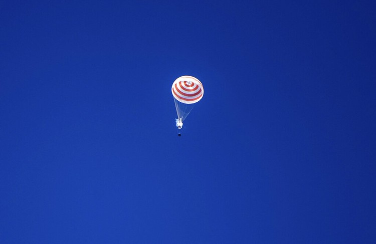 In this handout photo released by Gagarin Cosmonaut Training Centre (GCTC), Roscosmos space agency, U.S. astronauts Andrew Morgan, left, Jessica Meir, right, and Russian cosmonaut Oleg Skripochka sit in chairs shortly after the landing of the Russian Soyuz MS-15 space capsule near Kazakh town of Dzhezkazgan, Kazakhstan, Friday, April 17, 2020. An International Space Station crew has landed safely after more than 200 days in space. The Soyuz capsule carrying NASA astronauts Andrew Morgan, Jessica Meir and Russian space agency Roscosmos Oleg Skripochka touched down on Friday on the steppes of Kazakhstan. (Andrey Shelepin, Gagarin Cosmonaut Training Centre (GCTC), Roscosmos space agency, via AP)