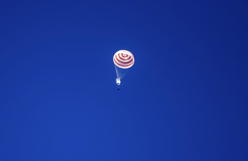 In this handout photo released by Gagarin Cosmonaut Training Centre (GCTC), Roscosmos space agency, U.S. astronauts Andrew Morgan, left, Jessica Meir, right, and Russian cosmonaut Oleg Skripochka sit in chairs shortly after the landing of the Russian Soyuz MS-15 space capsule near Kazakh town of Dzhezkazgan, Kazakhstan, Friday, April 17, 2020. An International Space Station crew has landed safely after more than 200 days in space. The Soyuz capsule carrying NASA astronauts Andrew Morgan, Jessica Meir and Russian space agency Roscosmos' Oleg Skripochka touched down on Friday on the steppes of Kazakhstan. (Andrey Shelepin, Gagarin Cosmonaut Training Centre (GCTC), Roscosmos space agency, via AP)