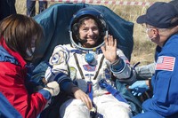In this handout photo released by Gagarin Cosmonaut Training Centre (GCTC), Roscosmos space agency, U.S. astronauts Andrew Morgan, left, Jessica Meir, right, and Russian cosmonaut Oleg Skripochka sit in chairs shortly after the landing of the Russian Soyuz MS-15 space capsule near Kazakh town of Dzhezkazgan, Kazakhstan, Friday, April 17, 2020. An International Space Station crew has landed safely after more than 200 days in space. The Soyuz capsule carrying NASA astronauts Andrew Morgan, Jessica Meir and Russian space agency Roscosmos Oleg Skripochka touched down on Friday on the steppes of Kazakhstan. (Andrey Shelepin, Gagarin Cosmonaut Training Centre (GCTC), Roscosmos space agency, via AP)