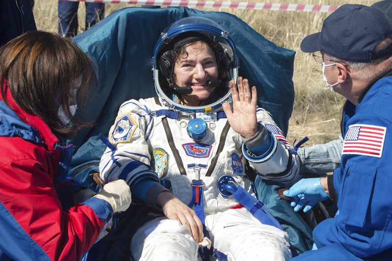 In this handout photo released by Gagarin Cosmonaut Training Centre (GCTC), Roscosmos space agency, U.S. astronauts Andrew Morgan, left, Jessica Meir, right, and Russian cosmonaut Oleg Skripochka sit in chairs shortly after the landing of the Russian Soyuz MS-15 space capsule near Kazakh town of Dzhezkazgan, Kazakhstan, Friday, April 17, 2020. An International Space Station crew has landed safely after more than 200 days in space. The Soyuz capsule carrying NASA astronauts Andrew Morgan, Jessica Meir and Russian space agency Roscosmos' Oleg Skripochka touched down on Friday on the steppes of Kazakhstan. (Andrey Shelepin, Gagarin Cosmonaut Training Centre (GCTC), Roscosmos space agency, via AP)