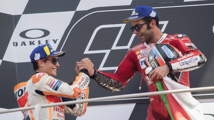 SCARPERIA, ITALY - JUNE 02: (L-R) Marc Marquez of Spain and Repsol Honda Team , Danilo Petrucci of Italy and Ducati Team celebrate on the podium at the end of the MotoGP race during the MotoGp of Italy - Race at Mugello Circuit on June 02, 2019 in Scarperia, Italy. (Photo by Mirco Lazzari gp/Getty Images)