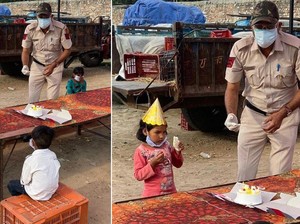 Polisi Ini Bawa Kue dan Rayakan Ulang Tahun Putri Seorang Buruh