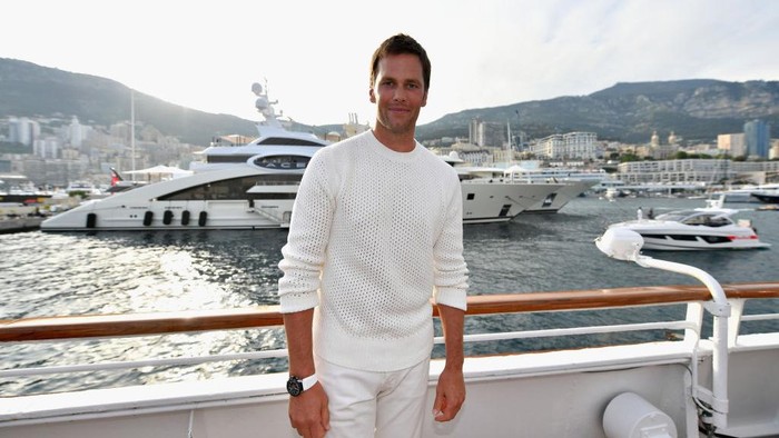 MONTE-CARLO, MONACO - MAY 26: NFL star Tom Brady poses for a photo after throwing a ball to Daniel Ricciardo of Australia and Red Bull Racing on the TAG Heuer boat after qualifying for the Monaco Formula One Grand Prix at Circuit de Monaco on May 26, 2018 in Monte-Carlo, Monaco.  (Photo by Dan Mullan/Getty Images)