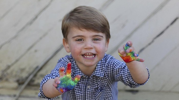 In this undated photo released Wednesday April 22, 2020, by Kensington Palace, showing a rainbow colours painted handprint done by Prince Louis, who celebrates his second birthday Thursday, April 23, 2020, in this photo taken by his mother, Kate the Duchess of Cambridge.  (The Duchess of Cambridge / Kensington Palace via AP)