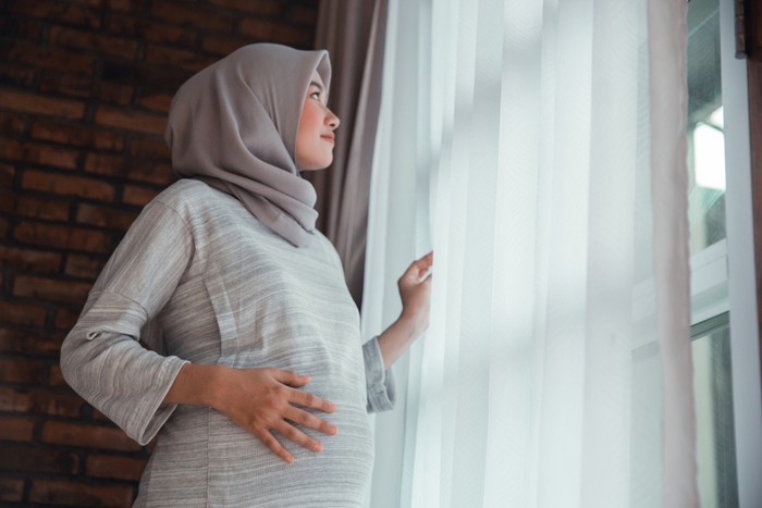 Ilustrasi wanita muslim hamil