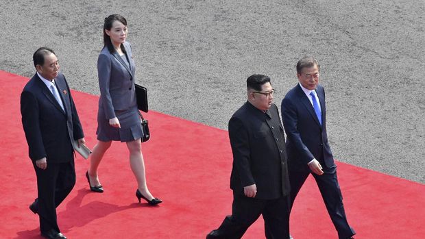 FILE - In this April 27, 2018, file photo, North Korean leader Kim Jong Un, second from right, walks with South Korean President Moon Jae-in, right, to hold their meeting at the border village of Panmunjom in Demilitarized Zone. Second from left is Kim's sister Kim Yo Jong. Kim Jong Un's disappearance from the public eye is raising speculation about not only his health but also about who's next in line to run North Korea if anything happens to the leader. Some experts say his sister and close associate Kim Yo Jong is most likely since North Korea has been ruled by the Kim family for seven decades. (Korea Summit Press Pool via AP, File)