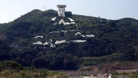 Kota Hantu Fengdu berada di Gunung Ming, utara Provinsi Chongqing, China. Fengdu punya sebuah patung mencolok setinggi 138 meter dan lebar 217 meter yang masuk Guiness World Record. (Getty Images/China Photos)