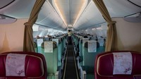 Penerbangan maskapai Myanmar National terlihat hampir kosong dari Yangon ke bandara Internasional Suvarnabhumi. Paula Bronstein/Getty Images.