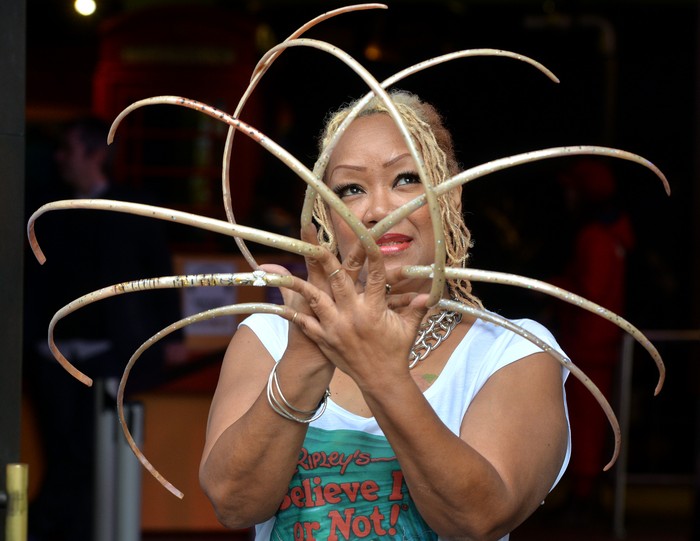 LONDON, ENGLAND - NOVEMBER 19:  Ripleys Believe It Or Not unveil Ayanna Williams, the Woman with 23 inch nails at Ripleys Believe It Or Not on November 19, 2014 in London, England.  (Photo by Anthony Harvey/Getty Images)