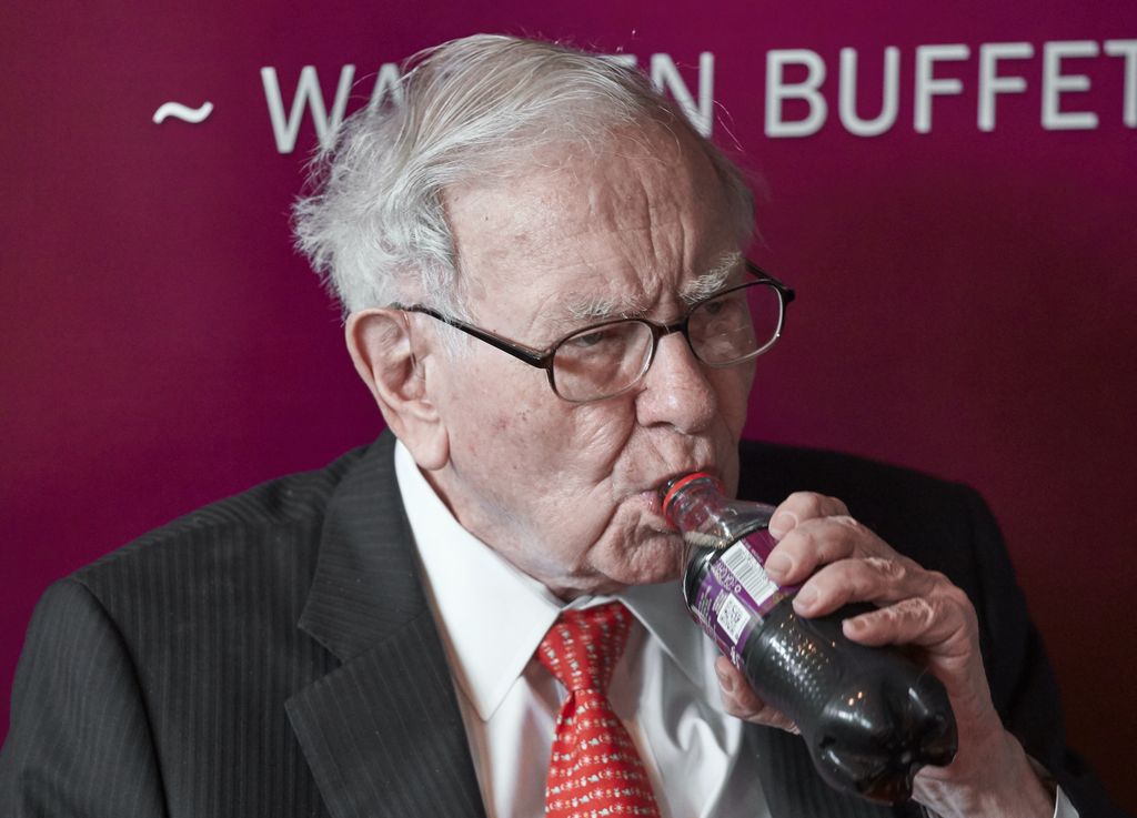 Warren Buffett, Chairman and CEO of Berkshire Hathaway, takes a sip of Cherry Coke during a game of bridge following the annual Berkshire Hathaway shareholders meeting in Omaha, Neb., Sunday, May 5, 2019. (AP Photo/Nati Harnik)