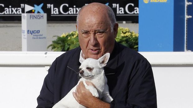 In this July 28, 2013 photo, Amancio Ortega Gaona, founding shareholder ofInditexfashion group, best known for its chain ofZaraclothing and accessories retail shops, holds a dog during the Casas Novas International Jumping Show in Arteixo, A Corua, in the Galicia region of northwest Spain. Amancio Ortega,has been named asthe richest person in Europe, andthe second richest in the whole world. (AP Photo/Iago Lopez)