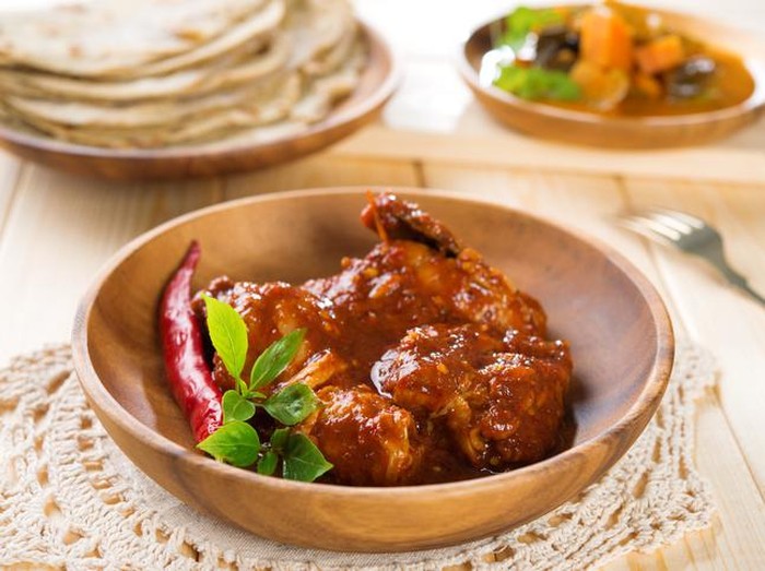 resep rendang ayam Lemak Lemang, traditional Malaysian food made of glutinous rice, coconut milk and salt. Cooked in a hollowed bamboo stick lined with banana leaves. Served during ramadan festival or hari raya.