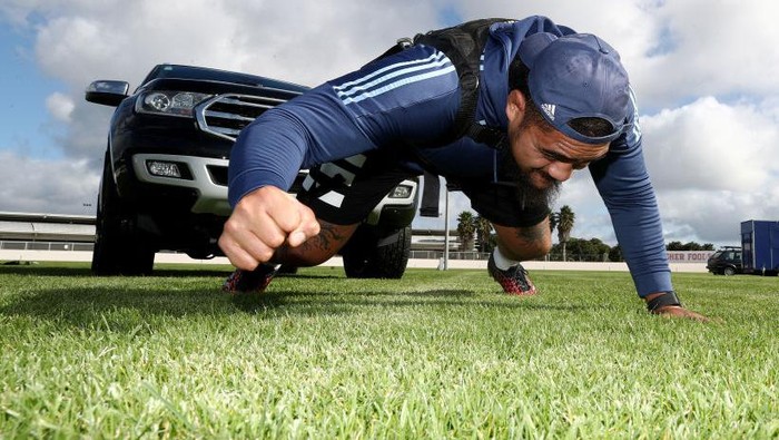 1223301253 AUCKLAND, NEW ZEALAND - MAY 07: All Black and Blues prop Ofa Tu'ungafasi pulls his SUV in a harness as he uses it in place of a scrum machine while he trains in isolation at the Blues HQ at Alexandra Park due to the coronavirus lockdown on May 07, 2020 in Auckland, New Zealand. New Zealand has been in lockdown since Thursday 26 March following tough restrictions imposed by the government to stop the spread of COVID-19 across the country. (Photo by Phil Walter/Getty Images)