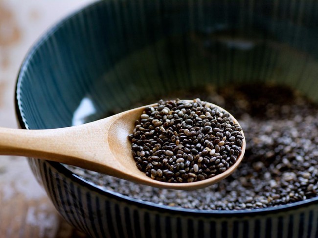 Nutritious chia seeds on a wooden spoon, superfood