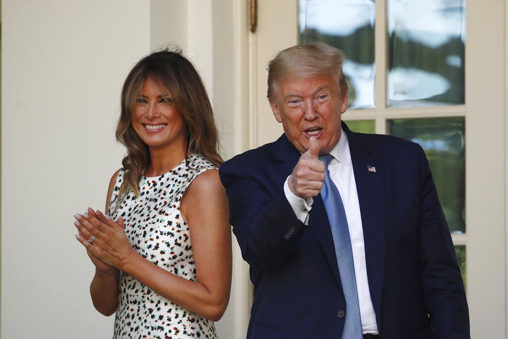 President Donald Trump gives a thumbs up as he and first lady Melania Trump leave after a presidential recognition ceremony in the Rose Garden of the White House, Friday, May 15, 2020, in Washington. (AP Photo/Alex Brandon)