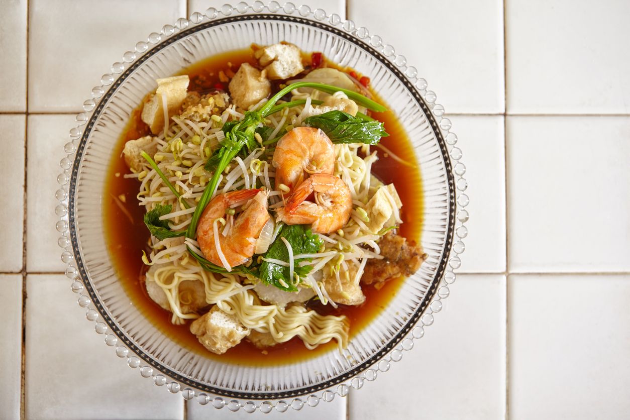Lontong mie in Indonesian for its famous traditional food, or in English maybe spelled rice cake and noodle in vegetable soup