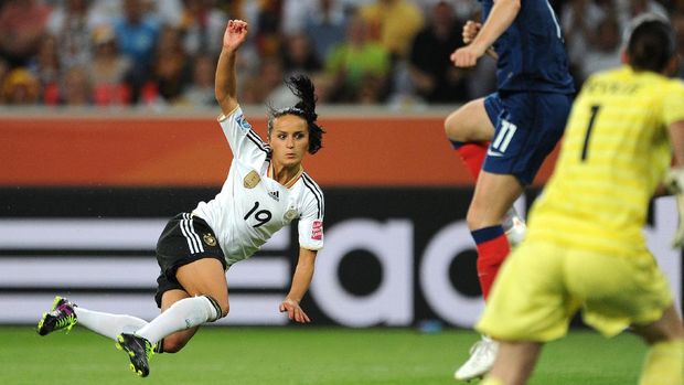 Germany's midfielder Fatmire Bajramaj (L) plays the ball during the France vs Germany Group A match of the FIFA women's football World Cup on July 5, 2011 in Moenchengladbach, western Germany. Germany won the match 2-4.     AFP PHOTO / PATRIK STOLLARZ (Photo by PATRIK STOLLARZ / AFP)