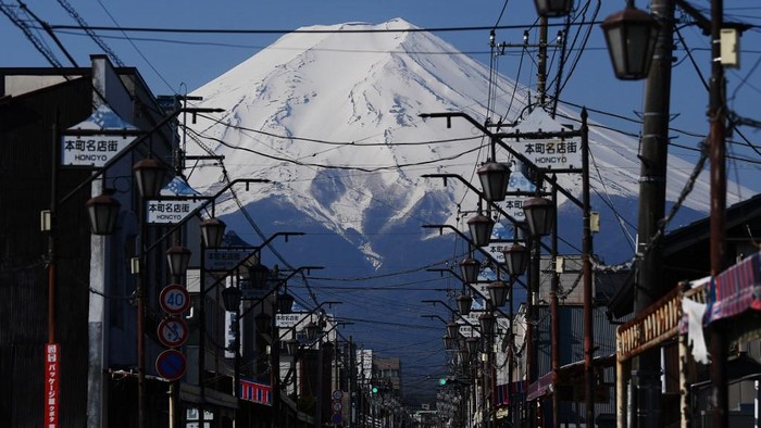 (FILES) In this file photo taken on April 30, 2020 Japans Mount Fuji is seen from the town of Fujiyoshida, Yamanashi prefecture. - Japans beloved Mount Fuji will be closed during this years summer climbing season to prevent the spread of the new coronavirus, officials said May 18, 2020. (Photo by CHARLY TRIBALLEAU / AFP)