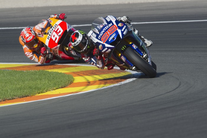 VALENCIA, SPAIN - NOVEMBER 08: Jorge Lorenzo of Spain and Movistar Yamaha MotoGP leads Marc Marquez of Spain and Repsol Honda Team
 during the MotoGP race during the MotoGP of Valencia - Race at Ricardo Tormo Circuit on November 8, 2015 in Valencia, Spain. (Photo by Mirco Lazzari gp/Getty Images)