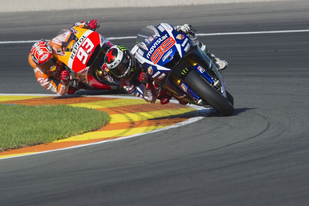 VALENCIA, SPAIN - NOVEMBER 08: Jorge Lorenzo of Spain and Movistar Yamaha MotoGP leads Marc Marquez of Spain and Repsol Honda Team during the MotoGP race during the MotoGP of Valencia - Race at Ricardo Tormo Circuit on November 8, 2015 in Valencia, Spain. (Photo by Mirco Lazzari gp/Getty Images)