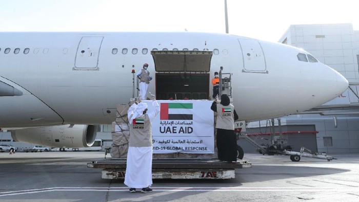 In this Tuesday, May 19, 2020 photo released by the state-run WAM news agency, an Etihad Airways flights loaded with aid for the Palestinians to fight the coronavirus pandemic is loaded in Abu Dhabi, United Arab Emirates. Etihad Airways flew aid for the Palestinians amid the coronavirus pandemic from the capital of the United Arab Emirates into Israel on Tuesday, marking the first known direct commercial flight between the two nations. (WAM via AP)