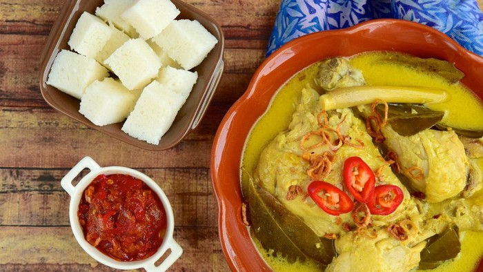 Opor ayam, chicken cooked in coconut milk from Central Java, Indonesia. Served with lontong and sambal. Popular dish for lebaran or Eid al-Fitr