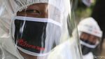 Unik, Kampanye Anti COVID-19 dengan Bawa Peti Mati