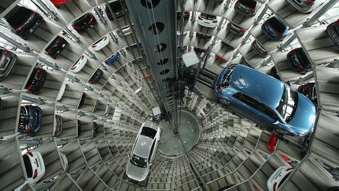 WOLFSBURG, GERMANY - DECEMBER 04: A Volkswagen t-roc is presented in one of the twin car towers at the Volkswagen Autostadt visitors center on December 4, 2018 in Wolfsburg, Germany. Volkswagen, Germanys biggest carmaker, has been embroiled in a costly emissions scandal after it installed illegal software in millions of its cars. The car giant announced recently that the company will face a difficult year in 2019 due to ongoing court cases stemming from the software, designed to manipulate emissions in diesel cars, which has so far cost the company EUR 28 billion in fines and costs. (Photo by Carsten Koall/Getty Images)