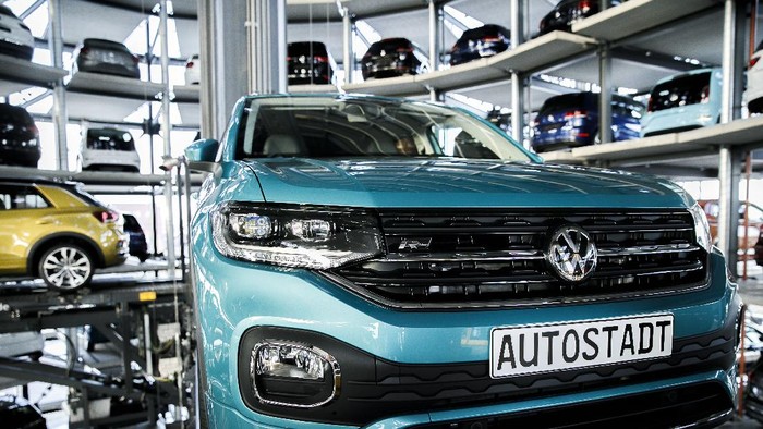 WOLFSBURG, GERMANY - DECEMBER 04: A Volkswagen t-roc is presented in one of the twin car towers at the Volkswagen Autostadt visitors center on December 4, 2018 in Wolfsburg, Germany. Volkswagen, Germanys biggest carmaker, has been embroiled in a costly emissions scandal after it installed illegal software in millions of its cars. The car giant announced recently that the company will face a difficult year in 2019 due to ongoing court cases stemming from the software, designed to manipulate emissions in diesel cars, which has so far cost the company EUR 28 billion in fines and costs. (Photo by Carsten Koall/Getty Images)