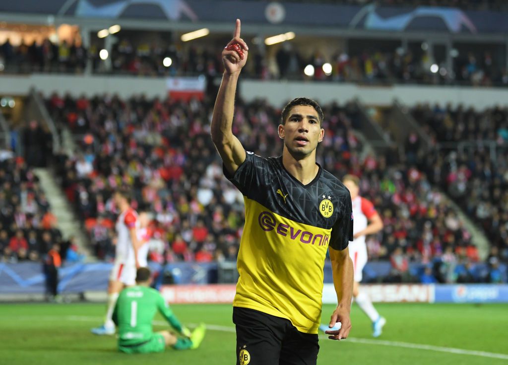 Achraf Hakimi PRAGUE, CZECH REPUBLIC - OCTOBER 02: Achraf Hakimi of Borussia Dortmund celebrates after scoring his sides second goal during the UEFA Champions League group F match between Slavia Praha and Borussia Dortmund at Eden Stadium on October 02, 2019 in Prague, Czech Republic. (Photo by Sebastian Widmann/Getty Images)
