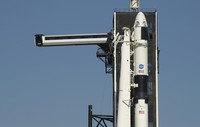 A SpaceX Falcon 9 rocket with the companys Crew Dragon spacecraft is rolled out of the horizontal integration facility at Launch Complex 39A as preparations continue for the Demo-2 mission, Thursday, May 21, 2020, at NASAs Kennedy Space Center in Cape Canaveral, Fla. (Bill Ingalls/NASA via AP)