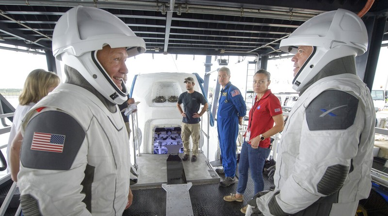 A SpaceX Falcon 9 rocket with the company's Crew Dragon spacecraft is rolled out of the horizontal integration facility at Launch Complex 39A as preparations continue for the Demo-2 mission, Thursday, May 21, 2020, at NASA's Kennedy Space Center in Cape Canaveral, Fla. (Bill Ingalls/NASA via AP)