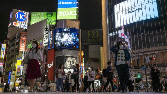 People walk across the popular 