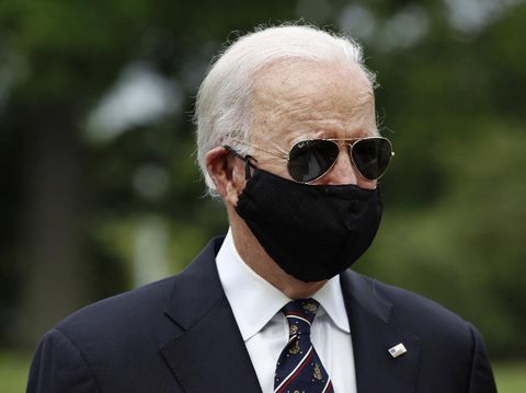 Democratic presidential candidate, former Vice President Joe Biden wears a face mask to protect against the spread of the new coronavirus as he and Jill Biden depart after placing a wreath at the Delaware Memorial Bridge Veterans Memorial Park, Monday, May 25, 2020, in New Castle, Del. (AP Photo/Patrick Semansky)