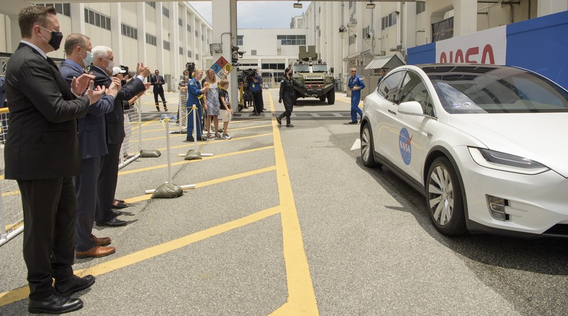 A NASA helicopter escorts the crew to Launch Pad 39-A, Wednesday, May 27, 2020, at Kennedy Space Center in Cape Canaveral, Fla. Two astronauts will fly on the SpaceX Demo-2 mission to the International Space Station scheduled for launch Wednesday. (AP Photo/David J. Phillip)