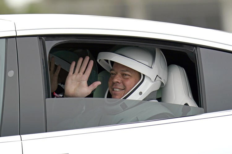 This combination of undated photos made available by SpaceX shows NASA astronauts Doug Hurley, left, and Bob Behnken in their spacesuits at SpaceX headquarters in Hawthorne, Calif. On Wednesday, May 27, 2020, They are scheduled to board a SpaceX Dragon capsule atop a SpaceX Falcon 9 rocket and, equipment and weather permitting, shoot into space. It will be the first astronaut launch from NASA’s Kennedy Space Center since the last shuttle flight in 2011. (SpaceX via AP)