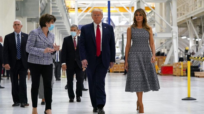President Donald Trump and first lady Melania Trump participate in a tour of NASA facilities before viewing the SpaceX Demonstration Mission 2 Launch at Kennedy Space Center, Wednesday, May 27, 2020, in Cape Canaveral, Fla. Vice President Mike Pence, left, and Marillyn Hewson, chief executive officer of Lockheed Martin, second from left. (AP Photo/Evan Vucci)