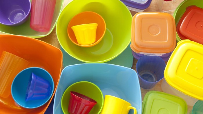 Top view of lots of plastic kitchen utensils, mostly containers