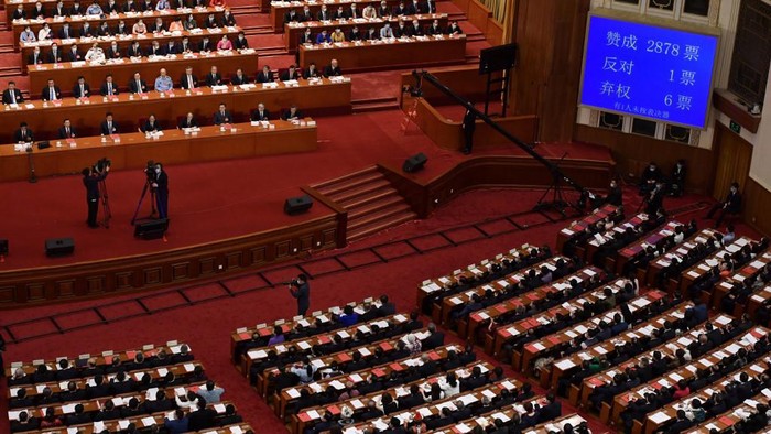 A screen shows the result of the vote on a proposal to draft a security law on Hong Kong during the closing session of the National Peoples Congress at the Great Hall of the People in Beijing on May 28, 2020. - Chinas rubber-stamp parliament endorsed plans May 28 to impose a national security law on Hong Kong that critics say will destroy the citys autonomy. (Photo by NICOLAS ASFOURI / AFP)