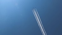 Langit biru yang cerah ditambah manuver pesawat tempur semakin memanjakan mata.
