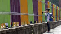 Kini lebih dari 200 sekolah di Korea Selatan terpaksa ditutup hanya beberapa hari setelah dibuka kembali, karena ada lonjakan kasus virus corona. Park Chul-hong/Yonhap via AP.