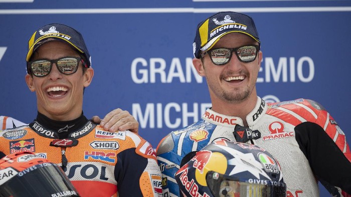 ALCANIZ, SPAIN - SEPTEMBER 22: Marc Marquez of Spain and Repsol Honda Team  (L) and Jack Miller of Australia and Pramac Racing 
 celebrate on the podium at the end of the MotoGP race during the MotoGp of Aragon - Race on September 22, 2019 in Alcaniz, Spain. (Photo by Mirco Lazzari gp/Getty Images)