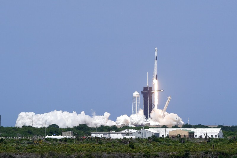 A SpaceX Falcon 9, with NASA astronauts Doug Hurley and Bob Behnken in the Crew Dragon capsule, lifts off from Pad 39-A at the Kennedy Space Center in Cape Canaveral, Fla., Saturday, May 30, 2020. The two astronauts are on the SpaceX test flight to the International Space Station. For the first time in nearly a decade, astronauts blasted towards orbit aboard an American rocket from American soil, a first for a private company. (AP Photo/David J. Phillip)