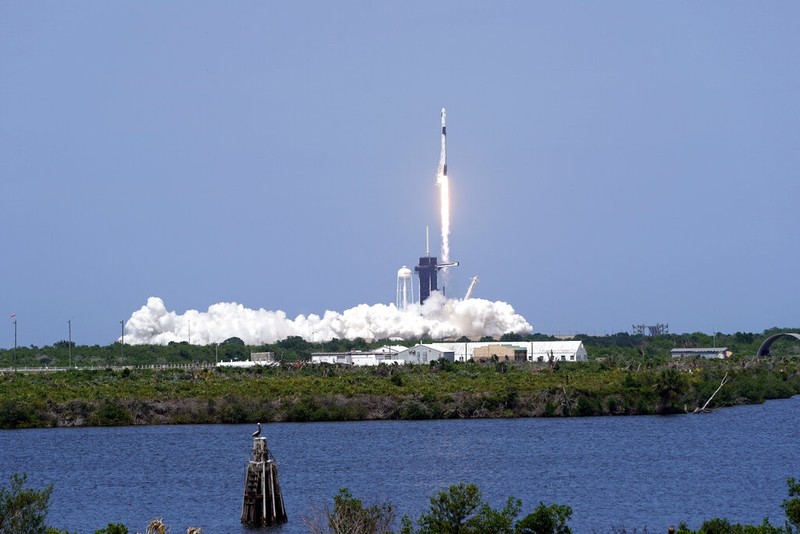 A SpaceX Falcon 9, with NASA astronauts Doug Hurley and Bob Behnken in the Crew Dragon capsule, lifts off from Pad 39-A at the Kennedy Space Center in Cape Canaveral, Fla., Saturday, May 30, 2020. The two astronauts are on the SpaceX test flight to the International Space Station. For the first time in nearly a decade, astronauts blasted towards orbit aboard an American rocket from American soil, a first for a private company. (AP Photo/David J. Phillip)