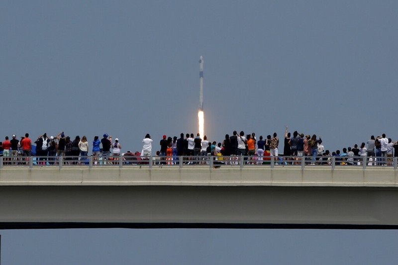 A SpaceX Falcon 9, with NASA astronauts Doug Hurley and Bob Behnken in the Crew Dragon capsule, lifts off from Pad 39-A at the Kennedy Space Center in Cape Canaveral, Fla., Saturday, May 30, 2020. The two astronauts are on the SpaceX test flight to the International Space Station. For the first time in nearly a decade, astronauts blasted towards orbit aboard an American rocket from American soil, a first for a private company. (AP Photo/David J. Phillip)