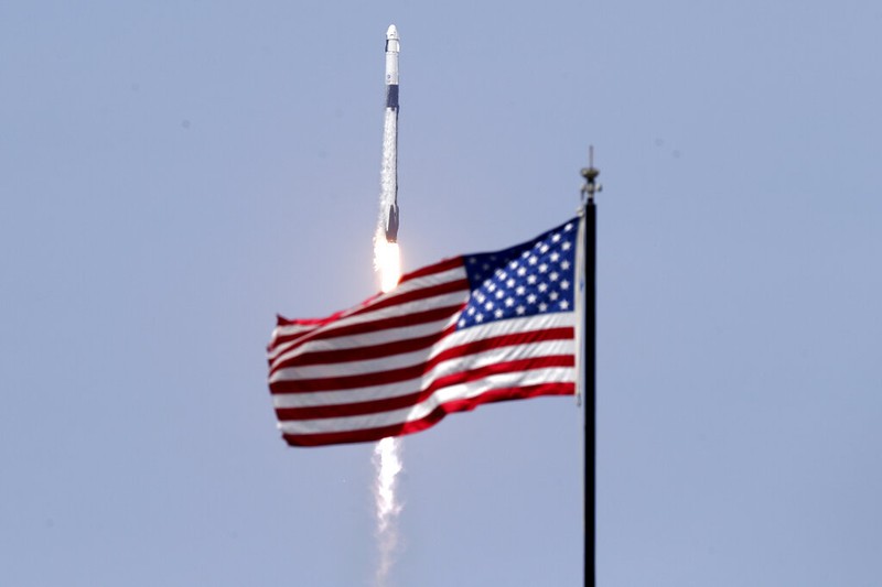 A SpaceX Falcon 9, with NASA astronauts Doug Hurley and Bob Behnken in the Crew Dragon capsule, lifts off from Pad 39-A at the Kennedy Space Center in Cape Canaveral, Fla., Saturday, May 30, 2020. The two astronauts are on the SpaceX test flight to the International Space Station. For the first time in nearly a decade, astronauts blasted towards orbit aboard an American rocket from American soil, a first for a private company. (AP Photo/David J. Phillip)