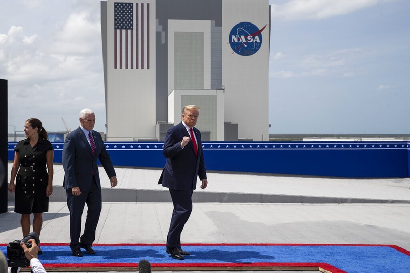 A SpaceX Falcon 9, with NASA astronauts Doug Hurley and Bob Behnken in the Crew Dragon capsule, lifts off from Pad 39-A at the Kennedy Space Center in Cape Canaveral, Fla., Saturday, May 30, 2020. The two astronauts are on the SpaceX test flight to the International Space Station. For the first time in nearly a decade, astronauts blasted towards orbit aboard an American rocket from American soil, a first for a private company. (AP Photo/David J. Phillip)