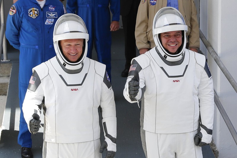 A SpaceX Falcon 9, with NASA astronauts Doug Hurley and Bob Behnken in the Crew Dragon capsule, lifts off from Pad 39-A at the Kennedy Space Center in Cape Canaveral, Fla., Saturday, May 30, 2020. The two astronauts are on the SpaceX test flight to the International Space Station. For the first time in nearly a decade, astronauts blasted towards orbit aboard an American rocket from American soil, a first for a private company. (AP Photo/David J. Phillip)