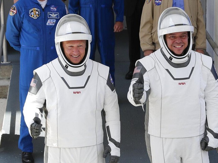 A SpaceX Falcon 9, with NASA astronauts Doug Hurley and Bob Behnken in the Crew Dragon capsule, lifts off from Pad 39-A at the Kennedy Space Center in Cape Canaveral, Fla., Saturday, May 30, 2020. The two astronauts are on the SpaceX test flight to the International Space Station. For the first time in nearly a decade, astronauts blasted towards orbit aboard an American rocket from American soil, a first for a private company. (AP Photo/David J. Phillip)